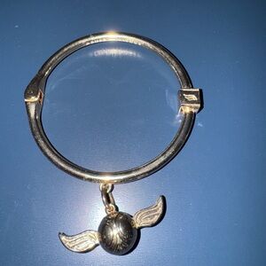 Warner Bros. Gold Bracelet with Winged Charm
